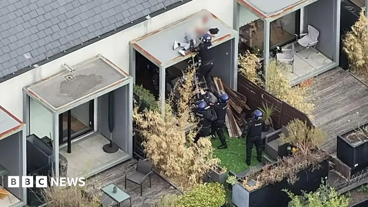 Greater Manchester Police Arrest Man Sleeping on Roof, Two Officers Injured